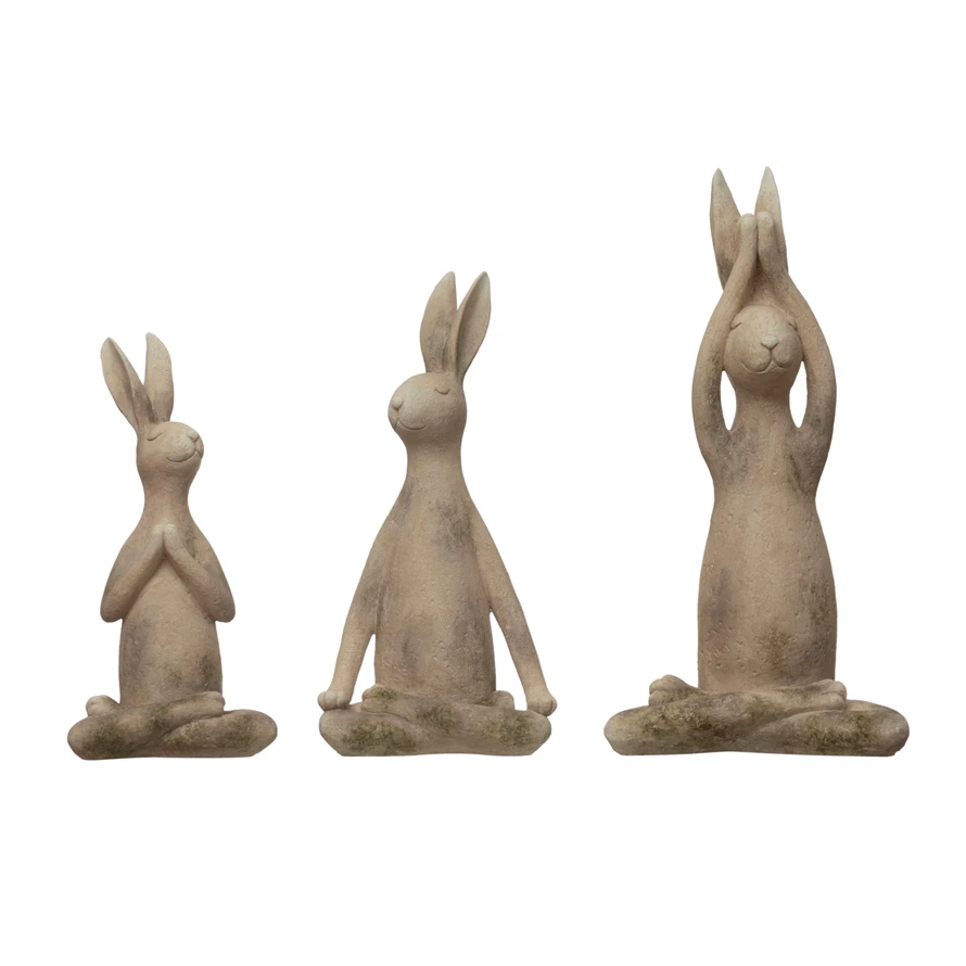 Antique white resin yoga rabbit figurine with a distressed finish.