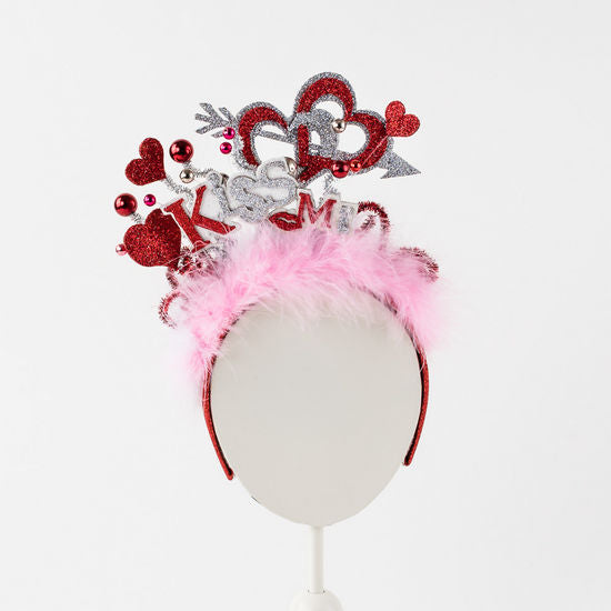 Cardboard Valentine's Day headband with a red heart motif.