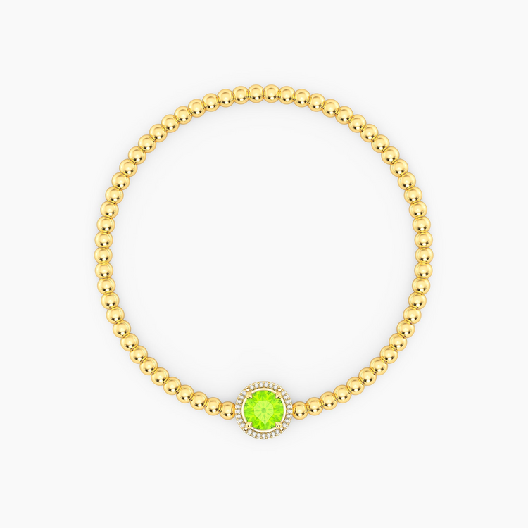 Gold beaded bracelet with a round green peridot center stone and a diamond halo.
