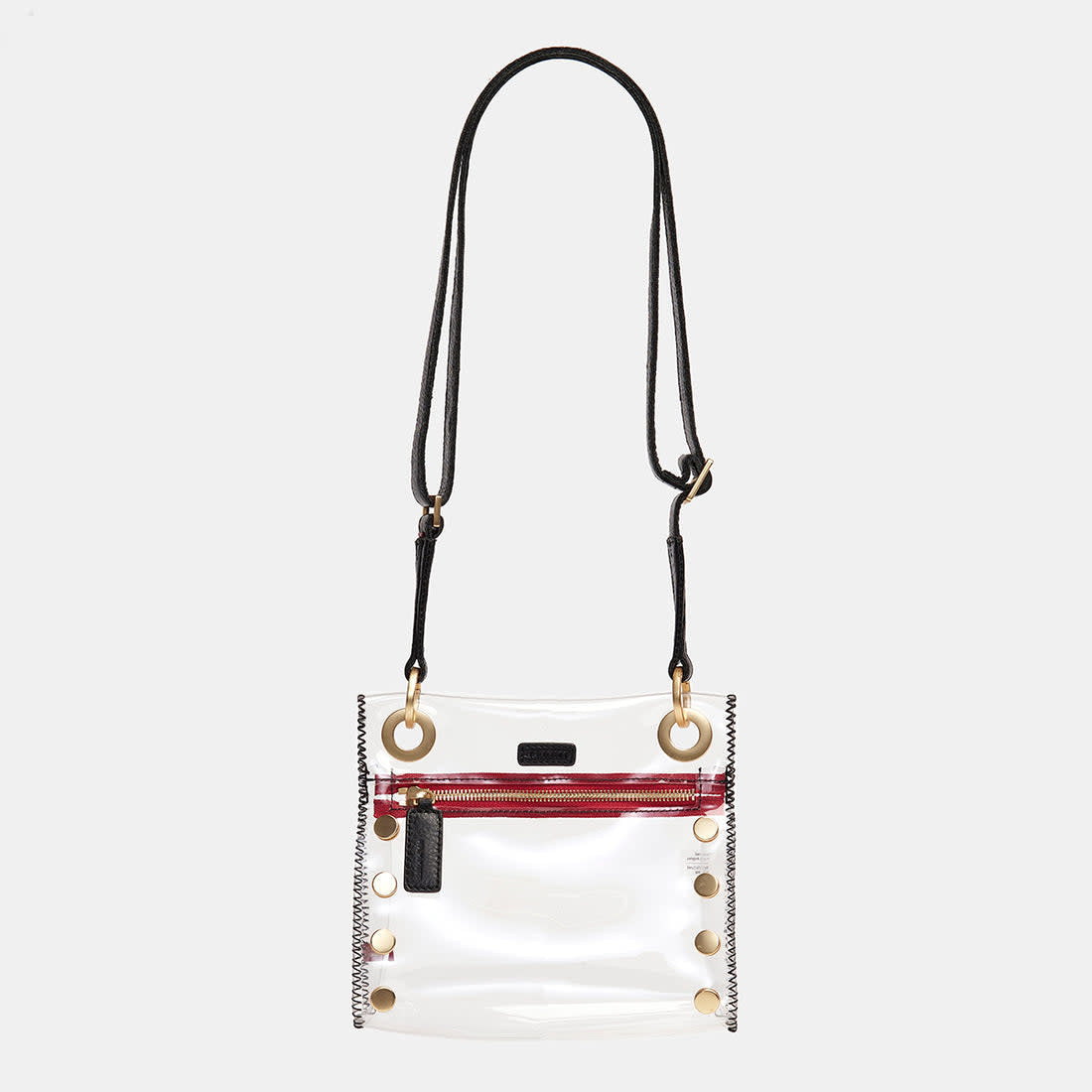 Small clear TPU bag with black brushed gold trim and red accents featuring an adjustable crossbody strap.