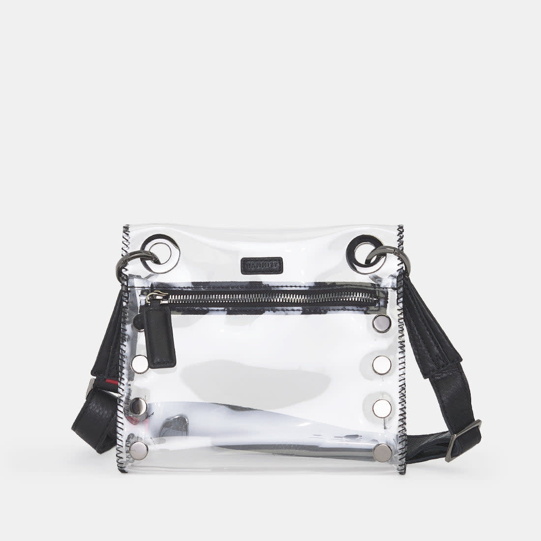 Small Tony clear bag with leather trim, adjustable strap, measuring 8 inches long and 7.5 inches high.