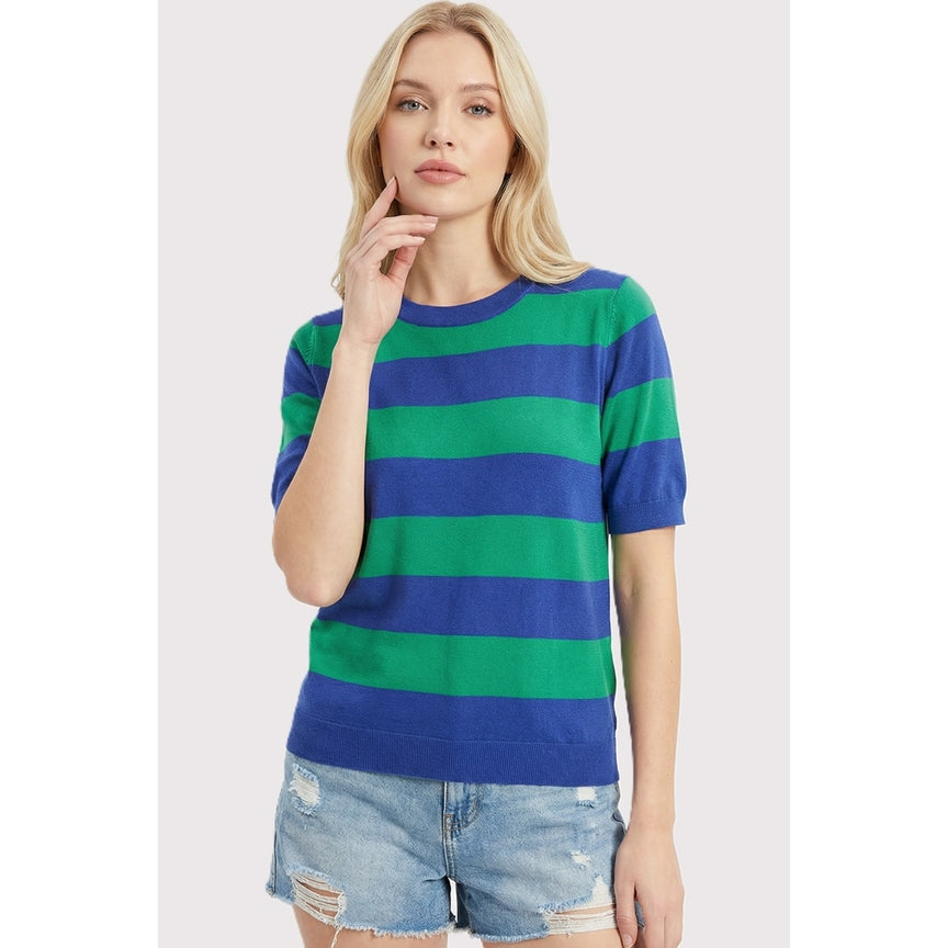 Woman wearing the Ruby Short Sleeves Striped Sweater in blue and green with denim shorts.