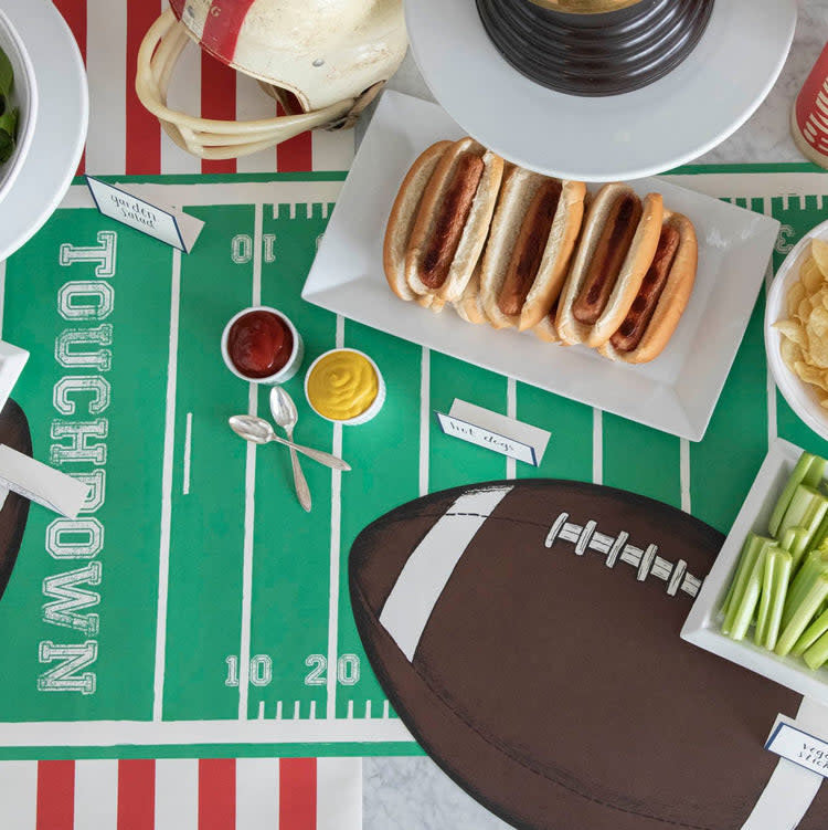 Paper table runner with football touchdown field pattern in green and gold.