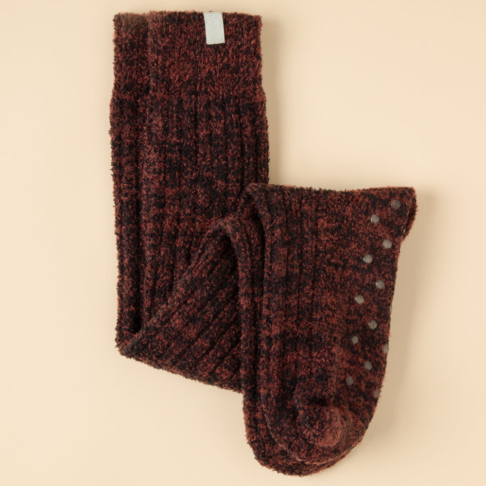 Slouchy marshmallow socks in heathered gray with non-slip grippers on the sole.