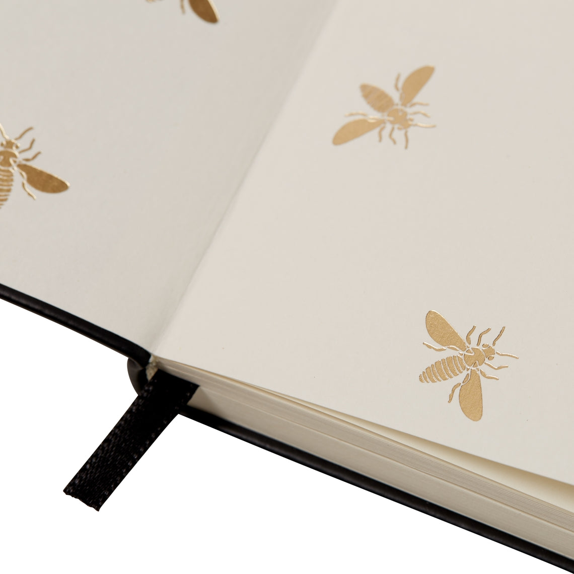 Black Essential Journal with foil-enhanced cover in a compact 5x7 inch size.