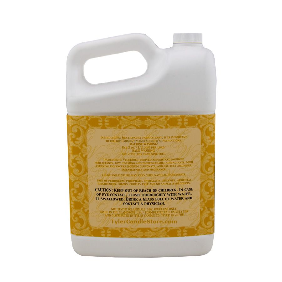 A 3.78L white plastic jug of Glamorous Wash detergent with a yellow label featuring text details.