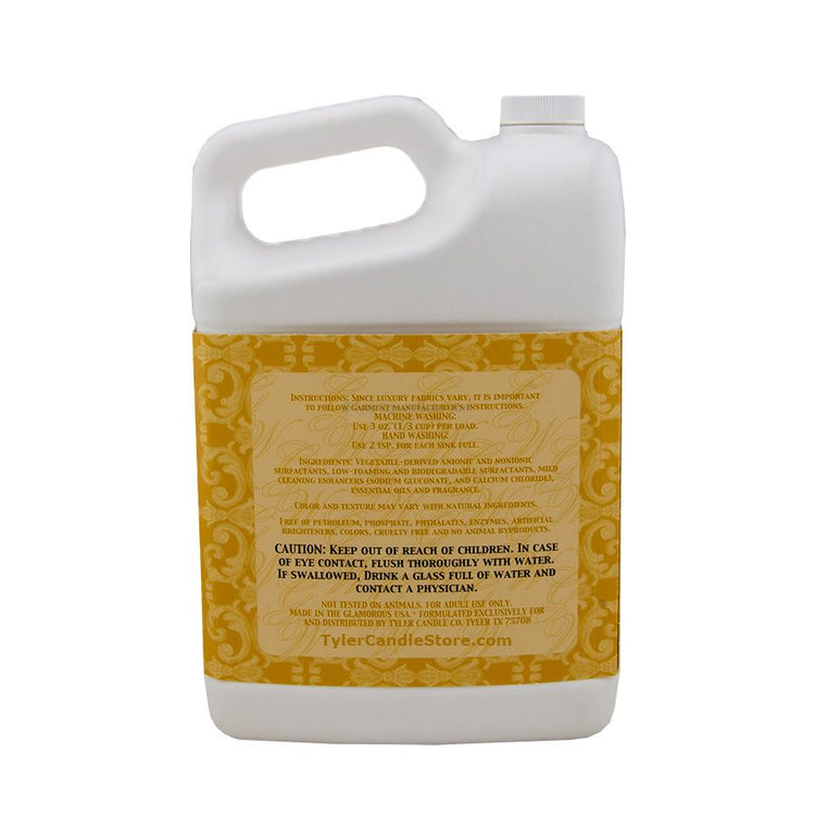 A 3.78L white plastic jug of Glamorous Wash detergent with a yellow label featuring text details.