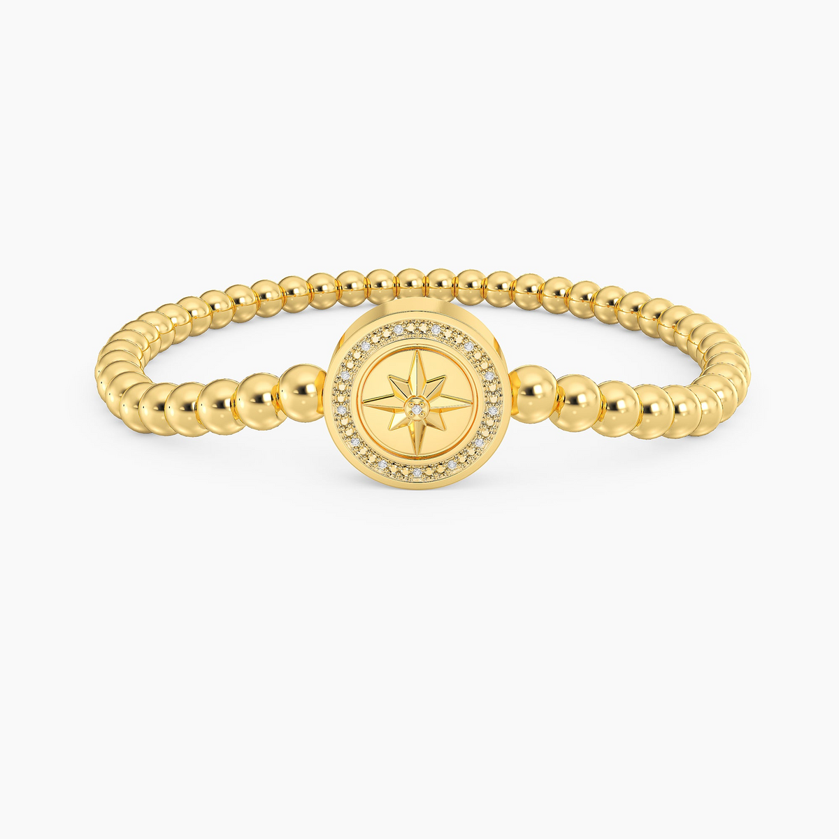 Gold beaded bracelet featuring a central compass star charm accented with small diamonds.
