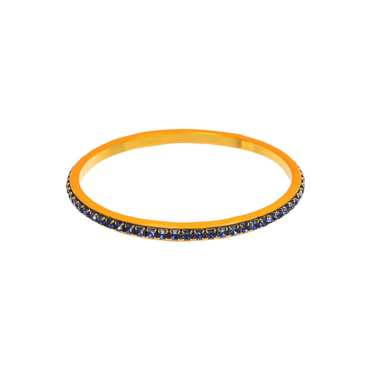 Hand-painted enamel bangle with colorful crystals on a sleek modern bracelet.