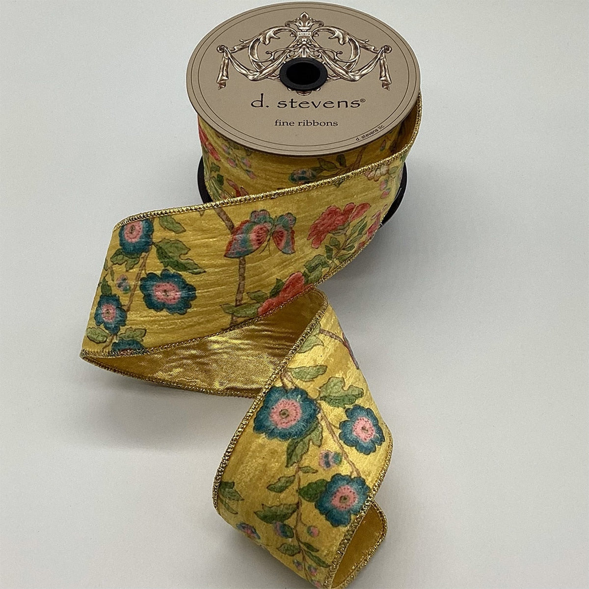 Satin ribbon with floral and bird motifs on a gold reverse side.