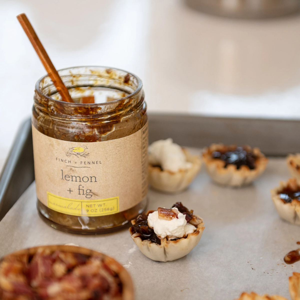Jar of Lemon + Fig Marmalade with a white lid