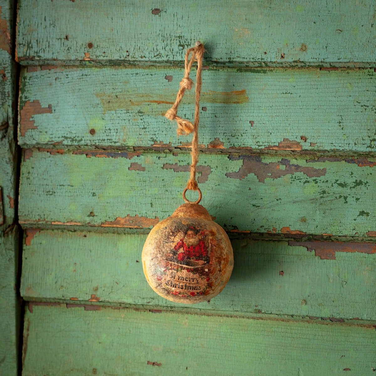 Four-inch metal ball ornament with subtle texture and shine