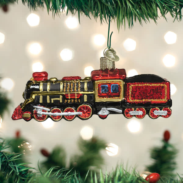 Black steam locomotive train ornament with gold accents on a white background.