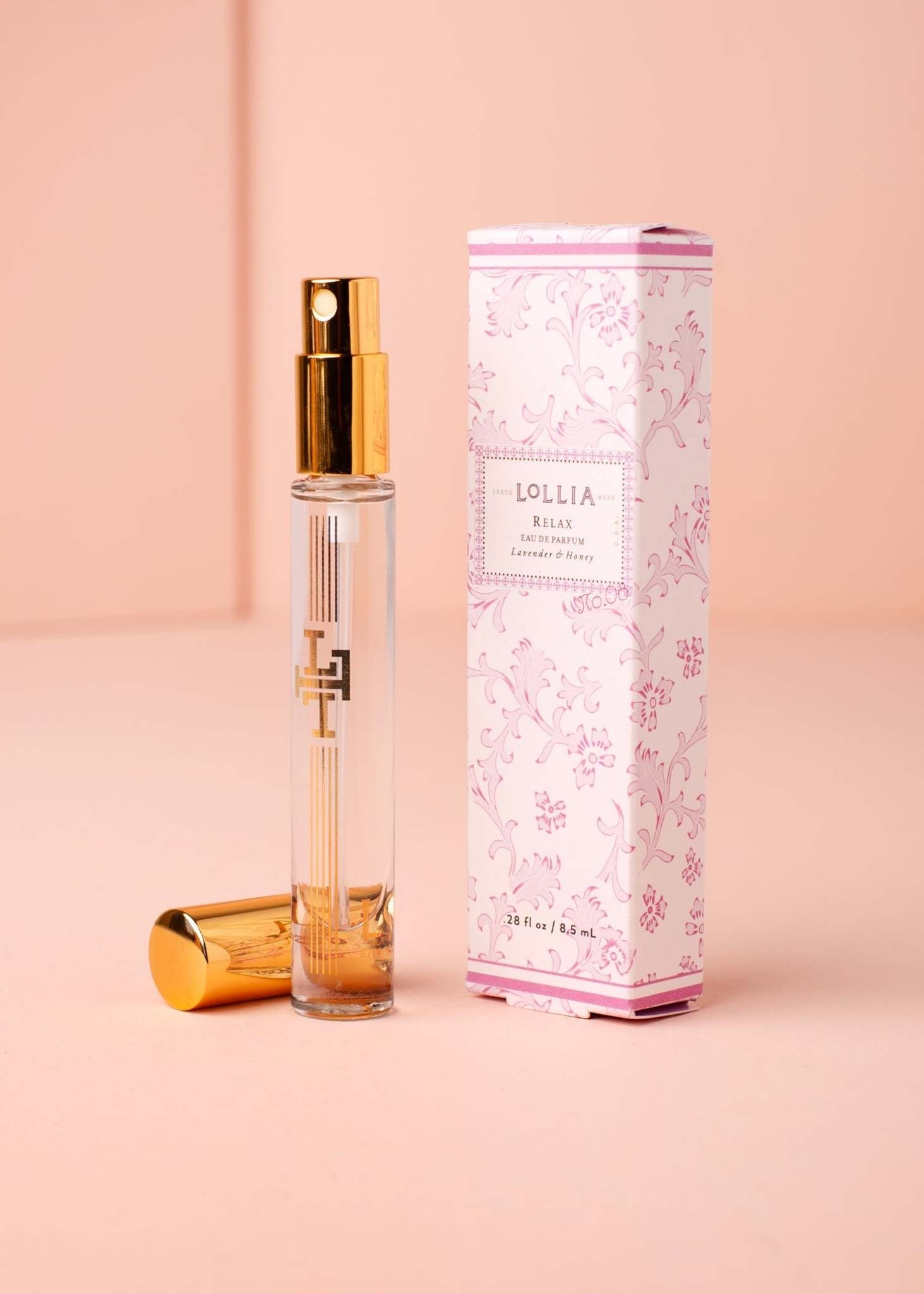 Travel Eau de Parfum in a gold-accented glass atomizer with gilded keepsake box.