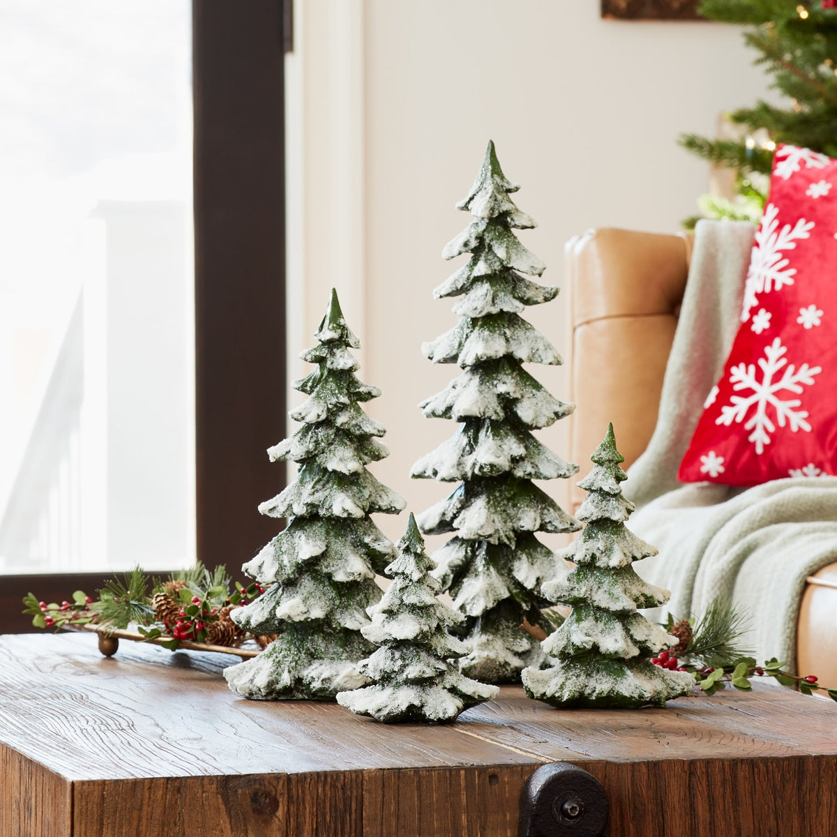 Polyresin pine tree ornament with snowy white finish in traditional holiday shape