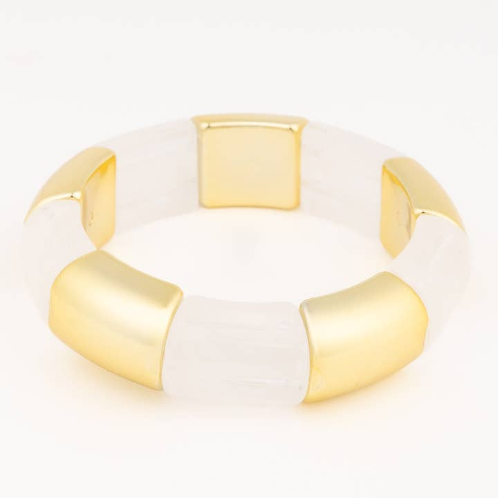 Audrey White Bracelet featuring alternating chunky gold and translucent white curved beads.
