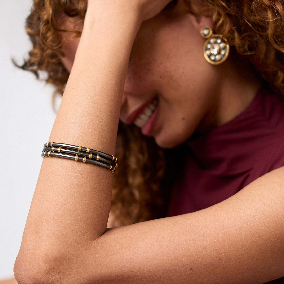 Sleek Tribeca stacking bangle in 0.2-inch wide 24K gold plate with a smooth silhouette.