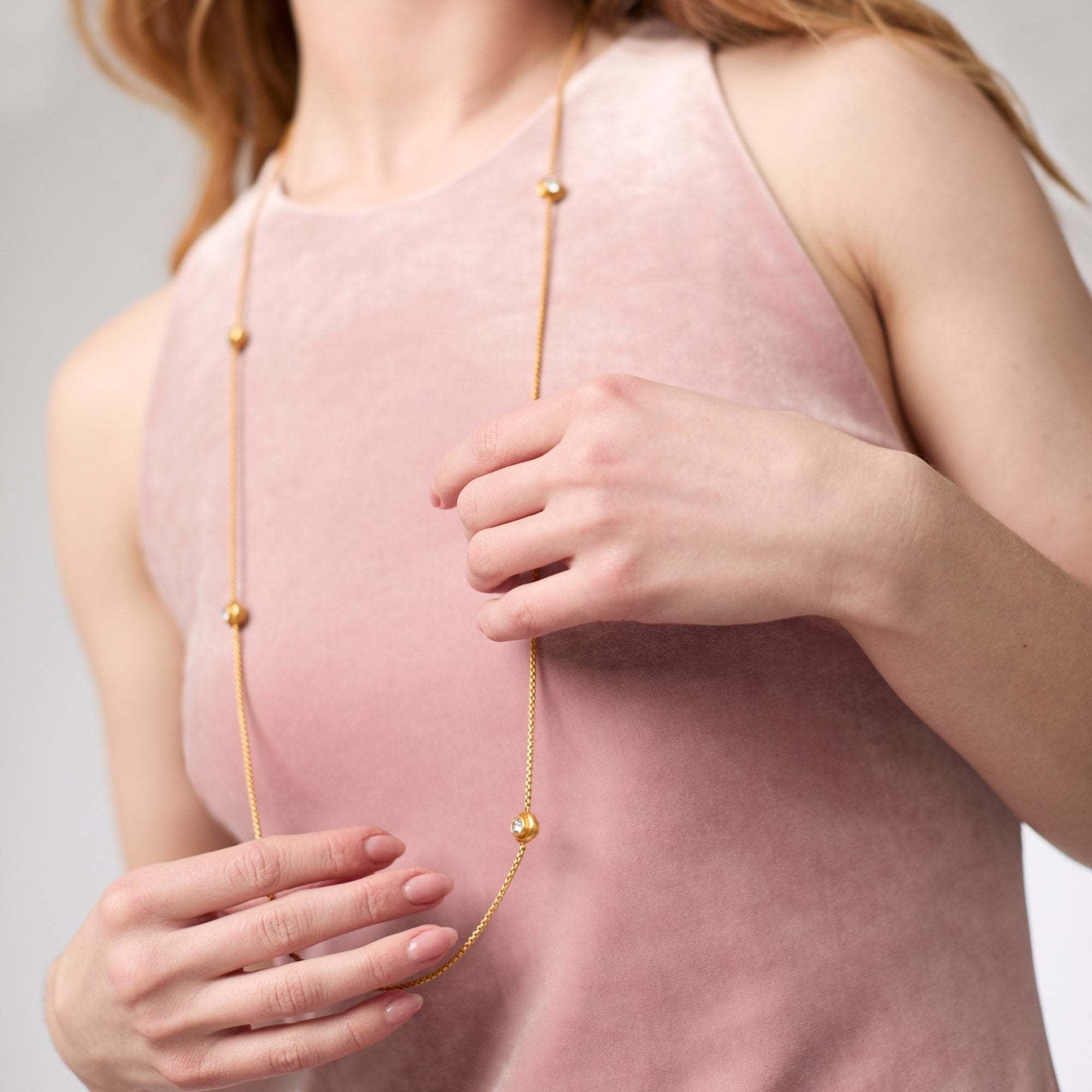 Tribeca Station necklace in gold-plated metal with cubic zirconia accents on a toggle clasp.