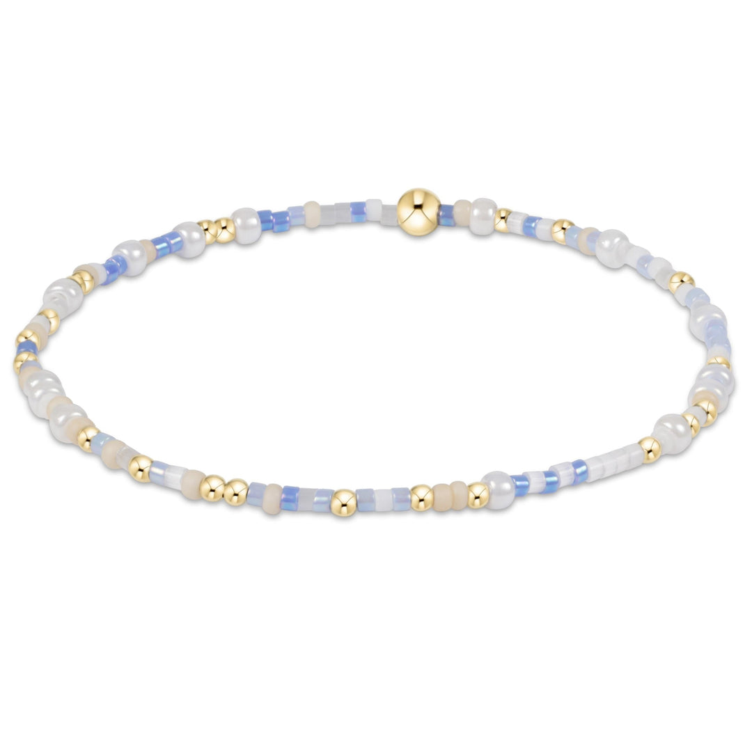 Egirl Hope Unwritten bracelet featuring gold-filled beads with multi-colored seed bead accents on stretch elastic.