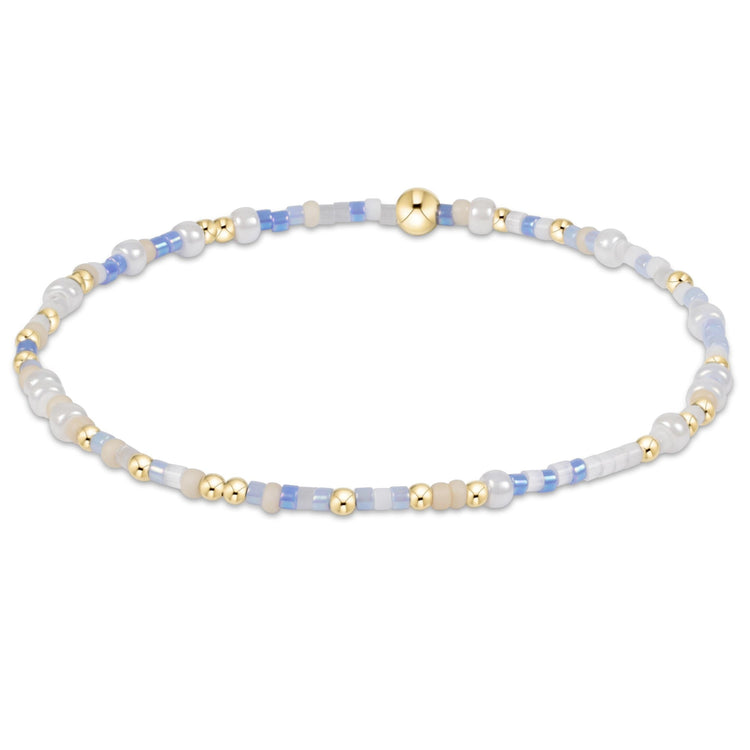 Egirl Hope Unwritten bracelet featuring gold-filled beads with multi-colored seed bead accents on stretch elastic.
