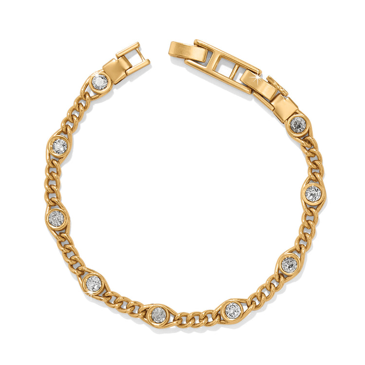Gold plated adjustable bracelet with fine quality crystals on a fold over clasp.