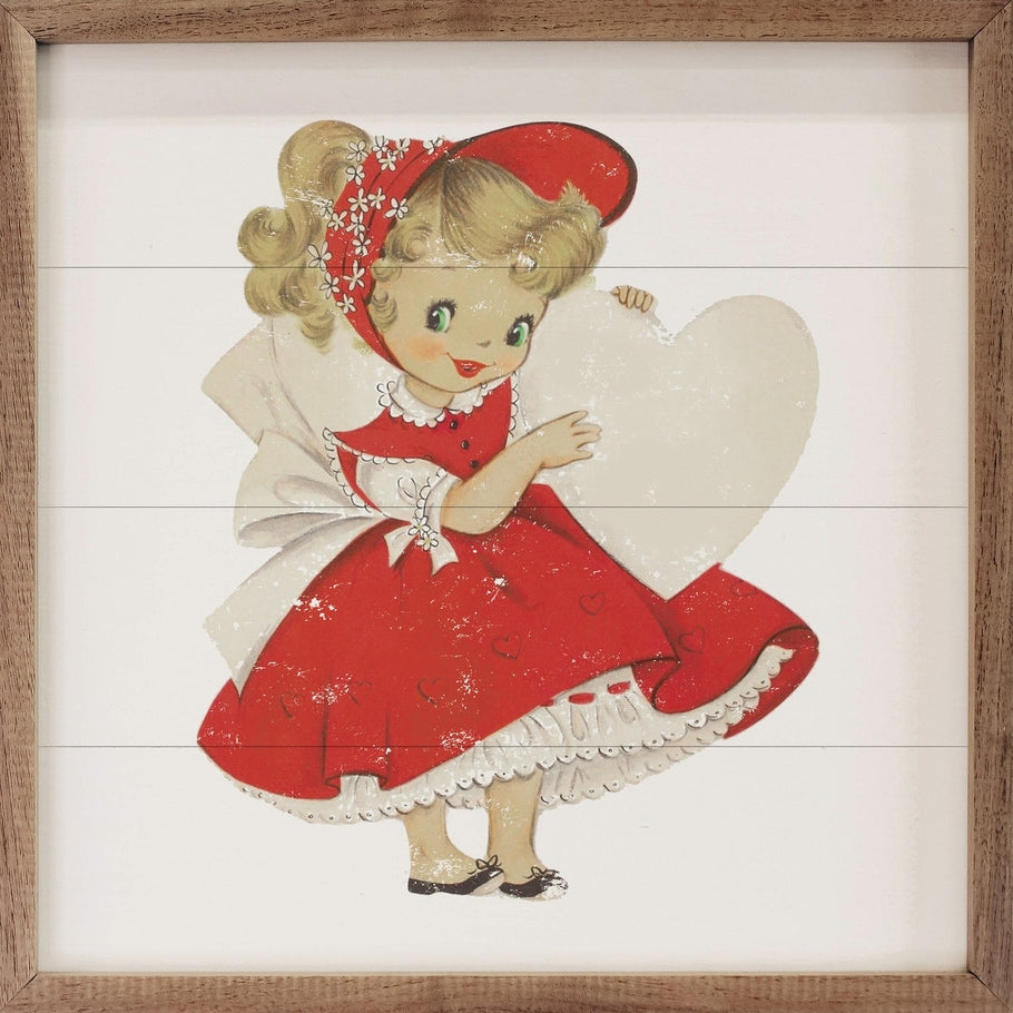 Vintage-style illustration of a girl in a red dress holding a large white heart in a wood frame.