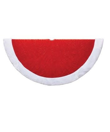 Traditional round red velvet tree skirt with white fabric trim