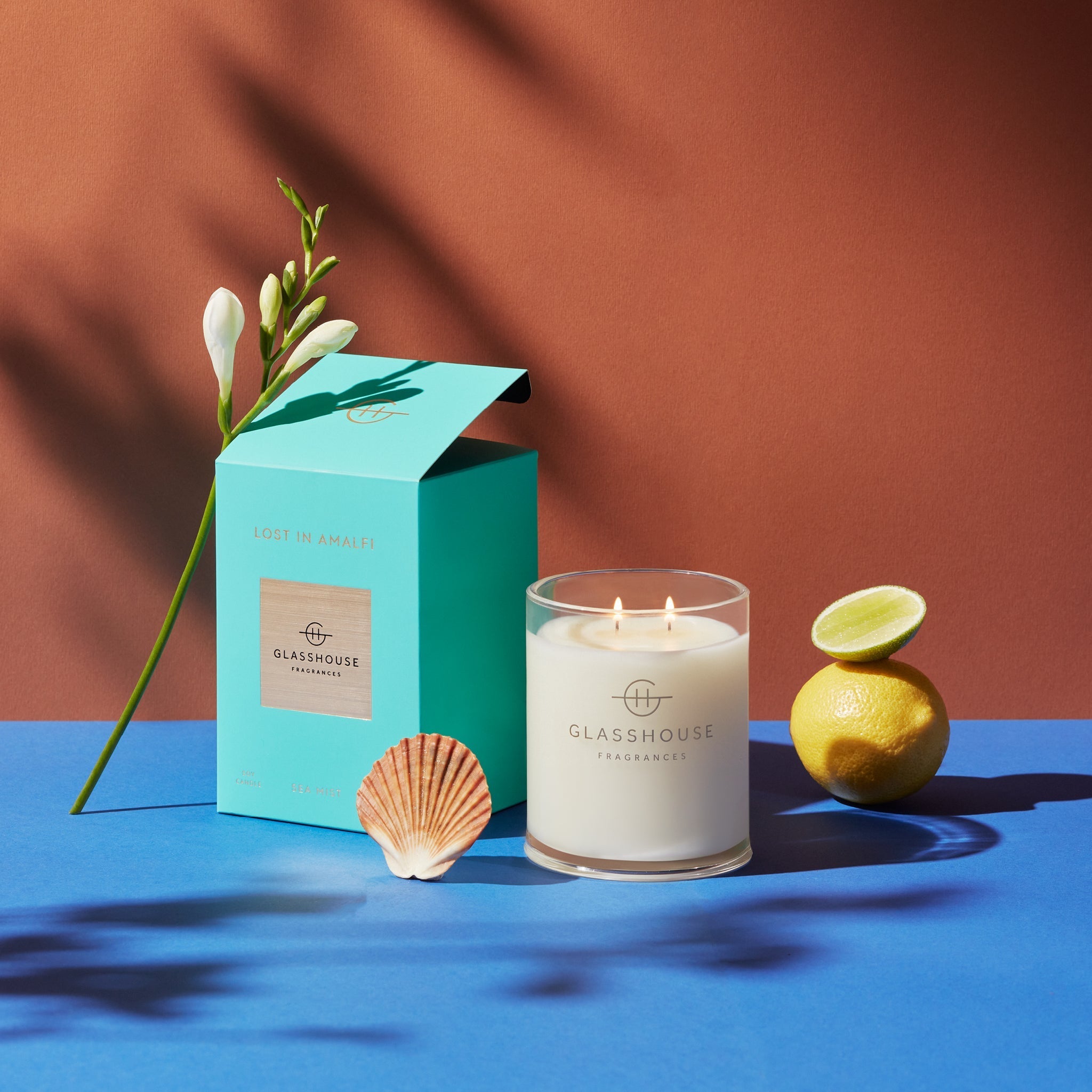 Glass jar candle in Lost In Amalfi scent with creamy white wax.