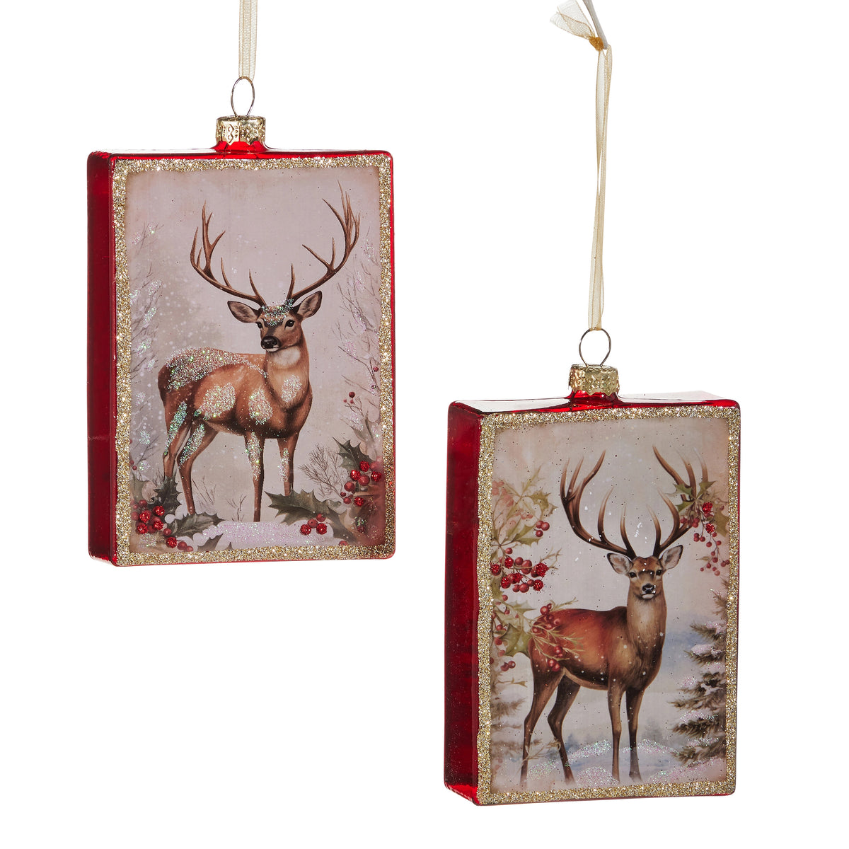 Two rectangular glass ornaments featuring a stag in a winter woodland scene with gold glitter trim.