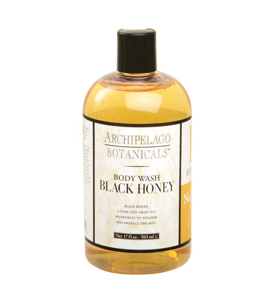 Front view of a black honey body wash bottle with ginger and grapefruit scent.