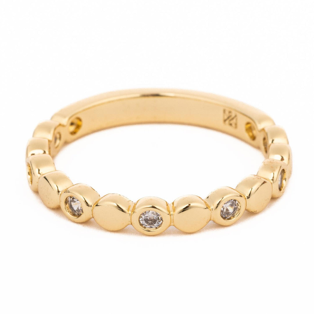18K gold plated ring with alternating polished gold discs and bezel-set clear crystals.