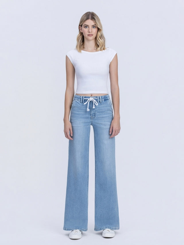 Front view of Maggie high-rise wide-leg jeans in blue denim with an elastic waistband and drawstring.