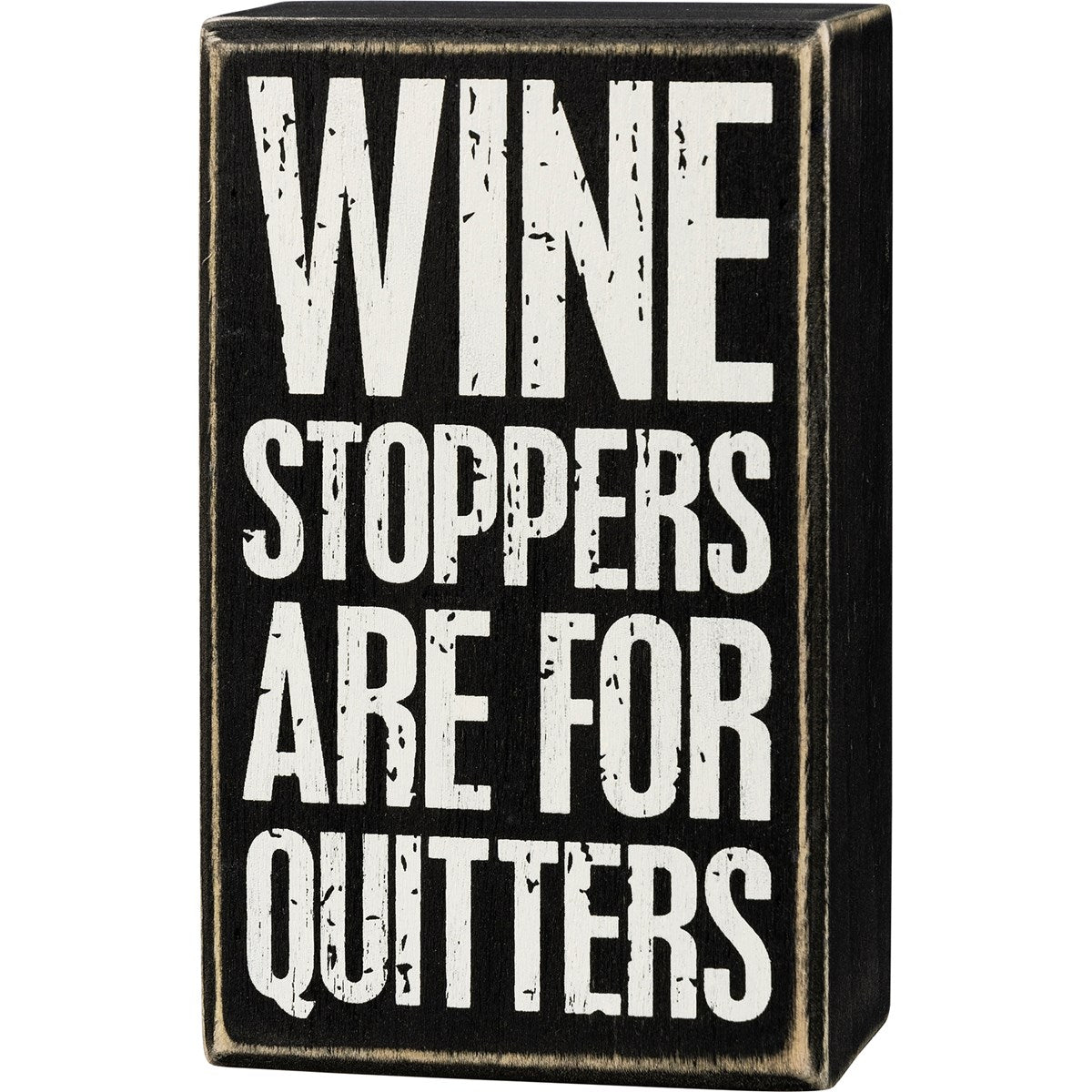 Black wooden box sign with white distressed text reading "WINE STOPPERS ARE FOR QUITTERS".