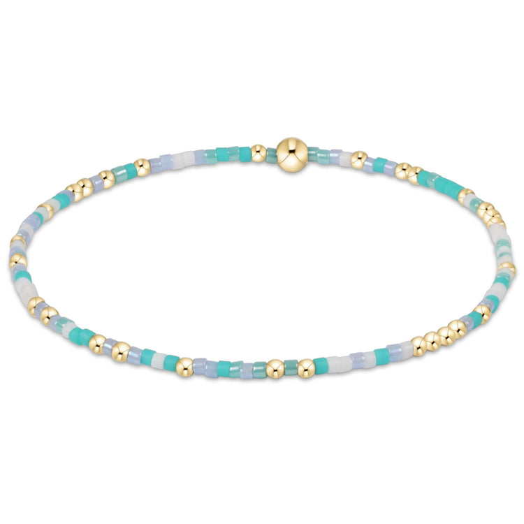 Egirl Hope Unwritten bracelet featuring gold-filled beads with multi-colored seed bead accents on stretch elastic.