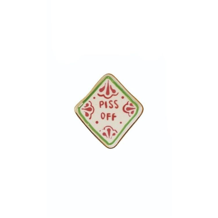 Diamond-shaped stoneware magnet with a green border and red text reading "PISS OFF".