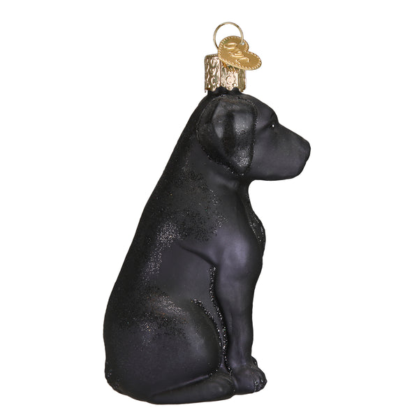 Black Labrador glass Christmas ornament in a sitting position with a gold heart charm.