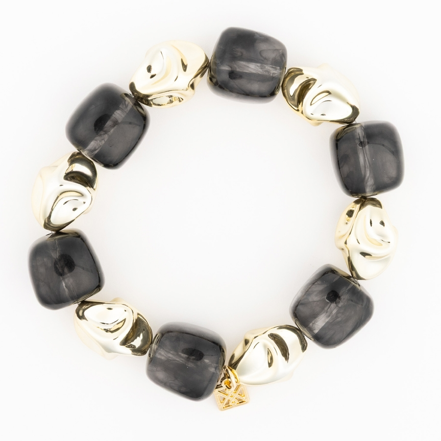 Lyla Bracelet featuring alternating chunky black marbled beads and polished gold-tone organic shapes.