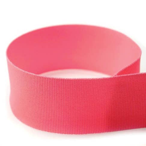 Spool of solid grosgrain ribbon with a smooth texture.