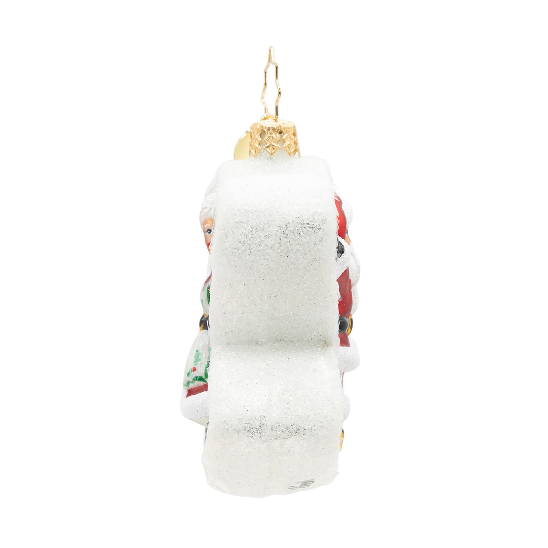 Side view of a Snow Angel Duo Gem glass ornament with white glitter and a gold hanging loop.