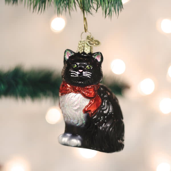 Glass tuxedo cat ornament with black bow tie standing on hind legs