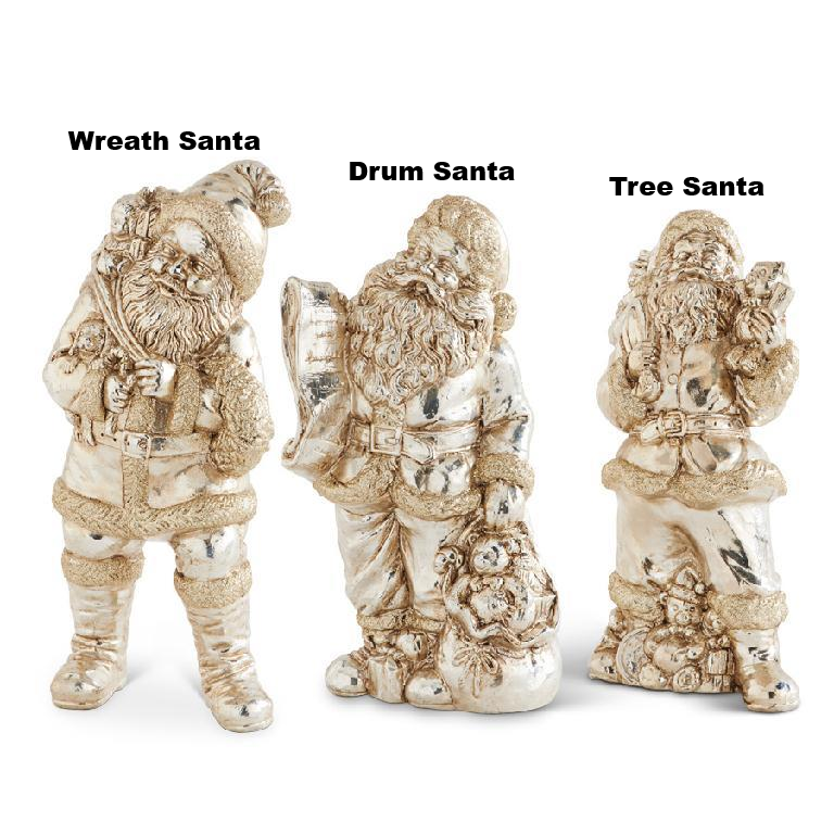 Three vintage-style champagne gold Santa figurines: Wreath Santa, Drum Santa, and Tree Santa.