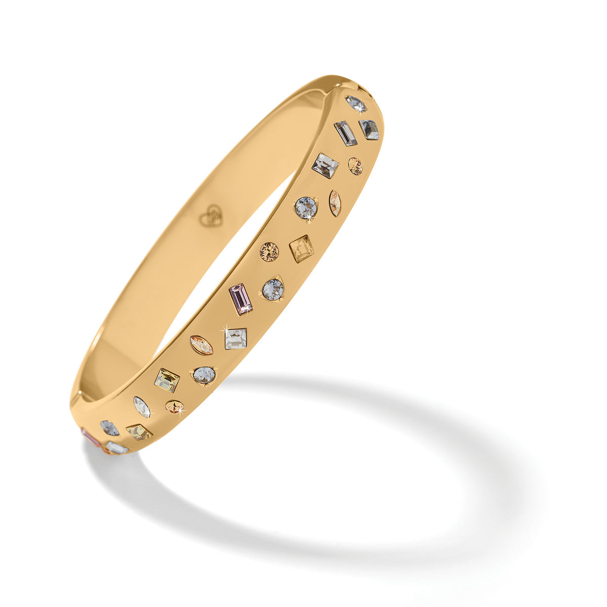 Gold-plated hinged bangle with multi-colored fine quality crystals in a circular silhouette.