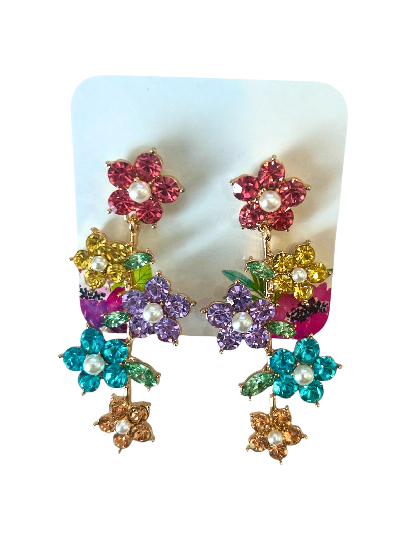 Cascading gold-toned earrings with five multi-colored crystal flowers and pearl centers.