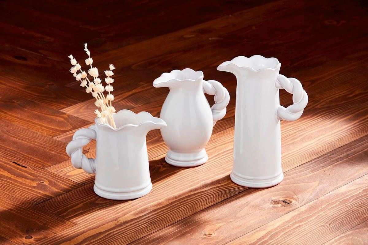 Glazed terracotta pitcher vase with twisted handle