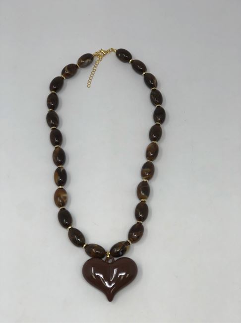 Roxie necklace featuring a bold geometric pendant on a delicate chain.