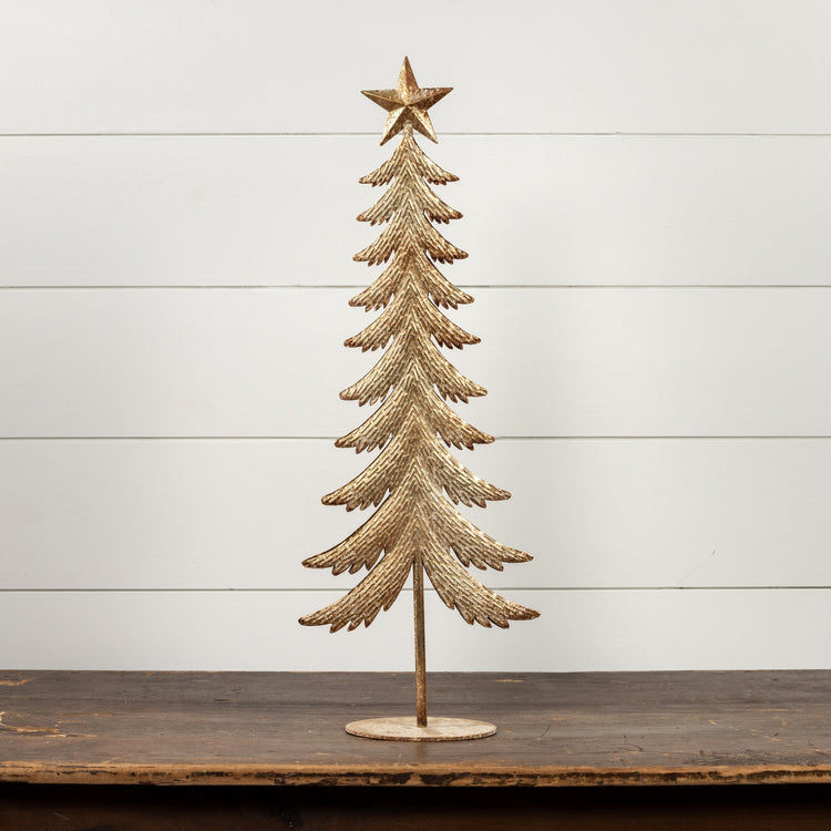 Gold metal tree sculpture with a star topper