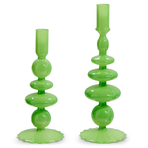 Green glass candle stick with a simple cylindrical shape.