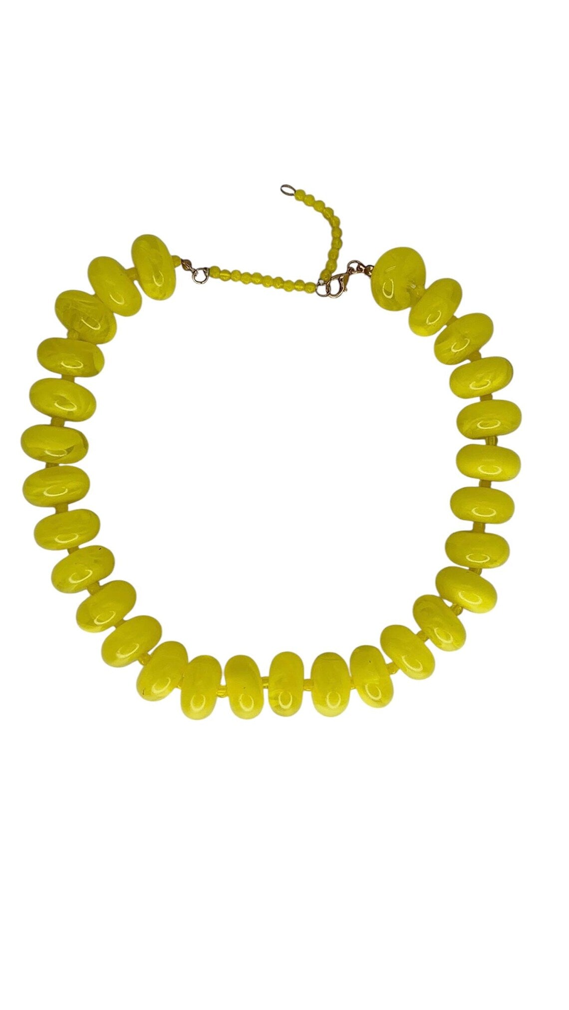 Candy Necklace featuring oversized, glossy yellow marbled beads with an adjustable chain closure.
