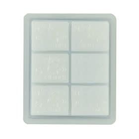 Tyler Mixer Melts in Dolce Vita scent displayed as a clear glass jar with white wax cubes.