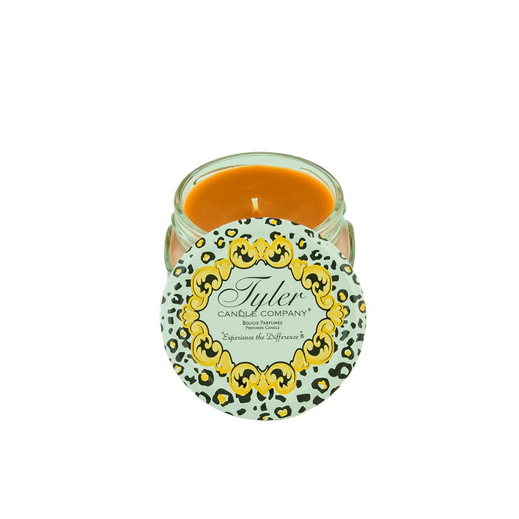 Tyler Candle Company 3.4oz Cowboy candle with a leopard print lid and orange wax.